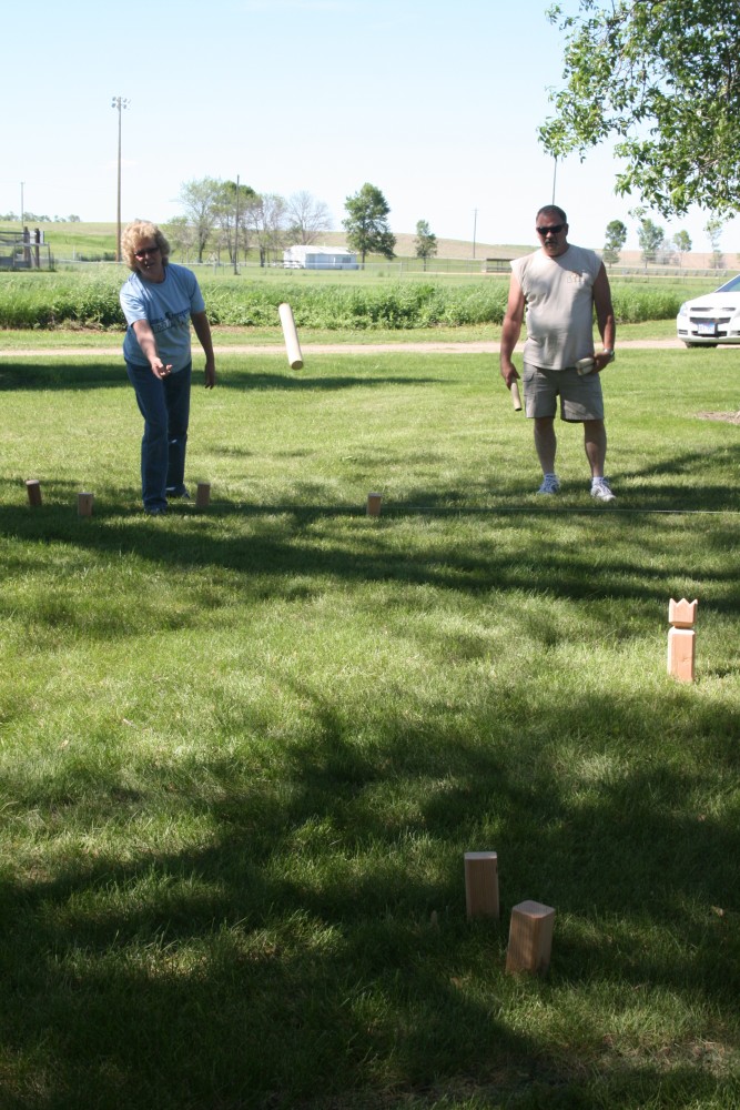 Sheryl and Rick Downes play kubb, a strategy stick-tossing game, during Finn Fest in Frederick, S.D., June 15, 2013.