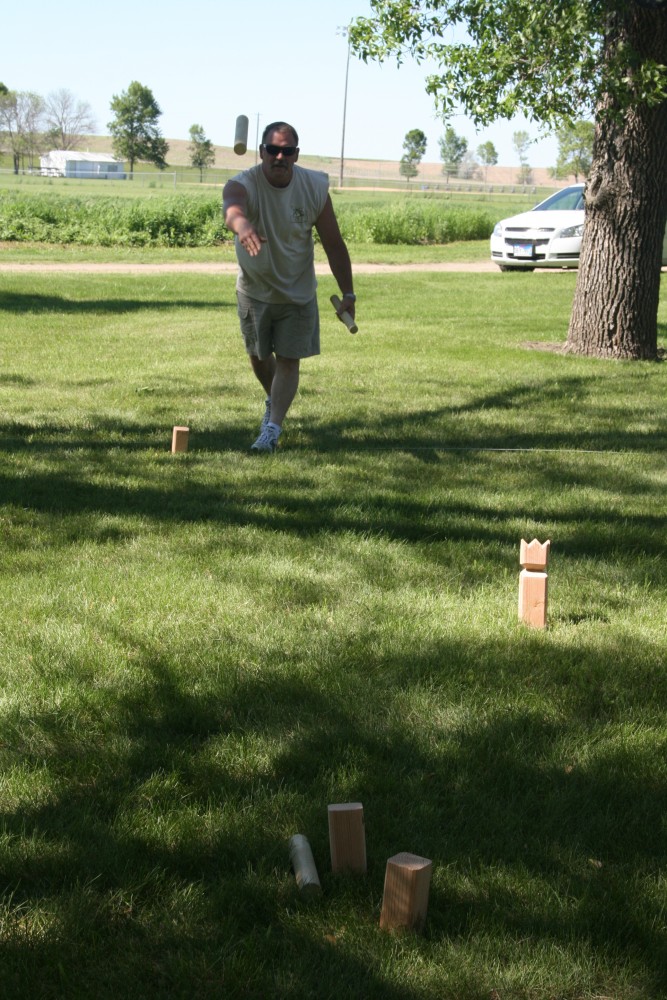 Rick Downes plays kubb, a strategy stick-tossing game, during Finn Fest in Frederick, S.D., June 15, 2013.