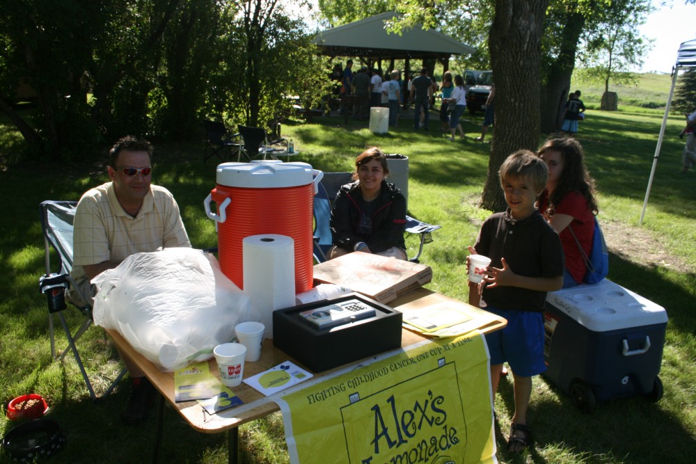 The Nordine family mans a lemonade stand that benefits a charity fighting childhood cancer during Finn Fest in Frederick on June 15, 2013.