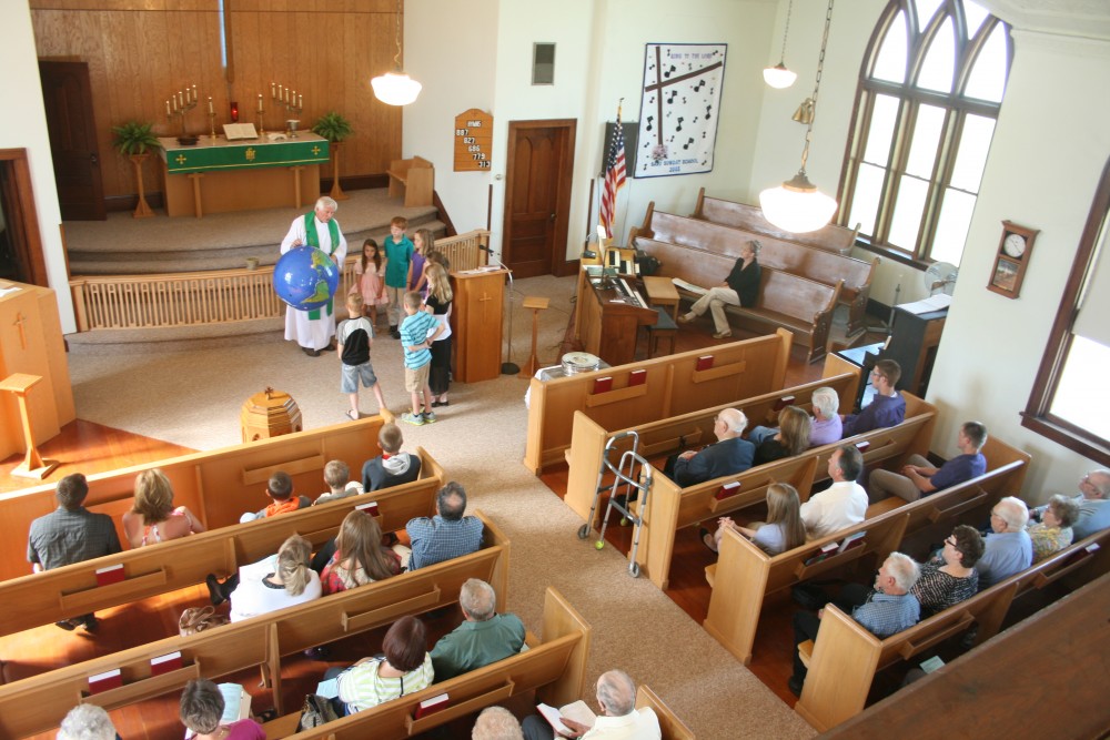 The Rev. Galen Sylvester gives the children's sermon during the Finn Fest worship service at Savo Lutheran Church in rural Frederick on June 16, 2013.